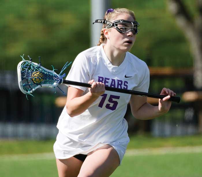 student playing lacrosse